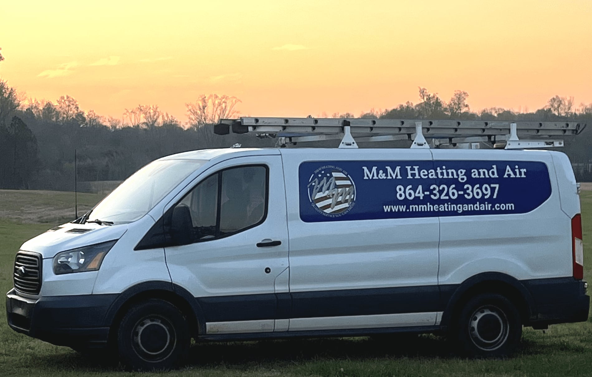 M&M Heating & Air Truck at Sunrise.